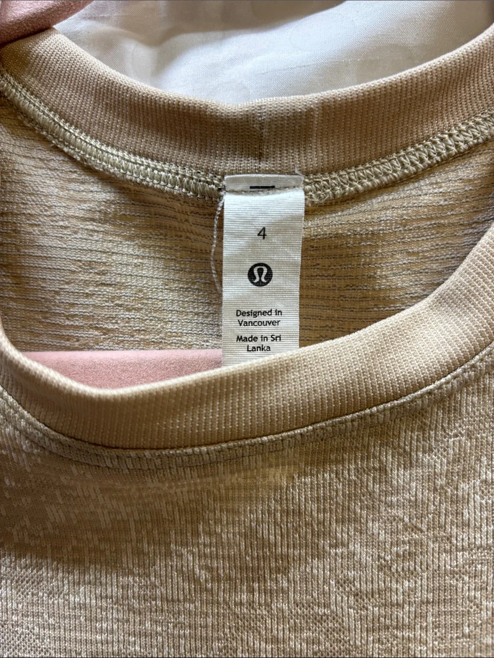 Lululemon Swiftly Breathe Muscle Tank in a metallic beige - size 4
